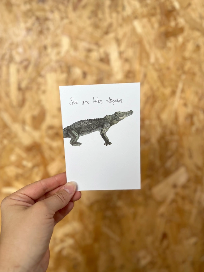 greetings card featuring an illustrated alligator and the phrase “see you later alligator”