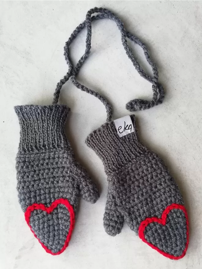 Eka heart tipped mittens for adults in grey and red.