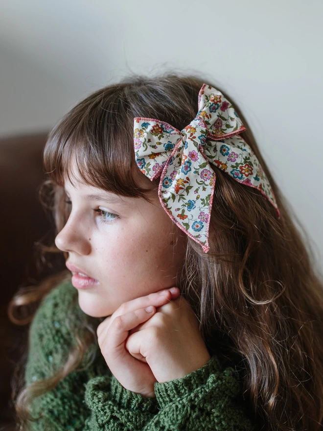 Girl with Liberty bow in the side of her hair