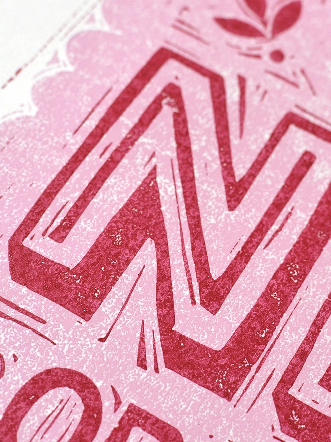 lino cut pink letter N