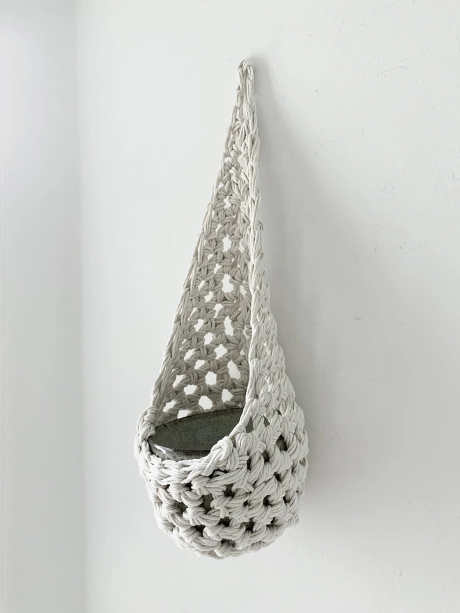large white indoor hanging wall planter plant basket handmade porch decor crochet boho eco friendly natural plant styling wall pot holder out door decor, indoor large white cotton hanging wall planter, white fabric wall mounted plant holder, handmade crochet plant basket, handmade sustainable crochet decor, rustic natural organic homeware accessories, hanging plant pot holder