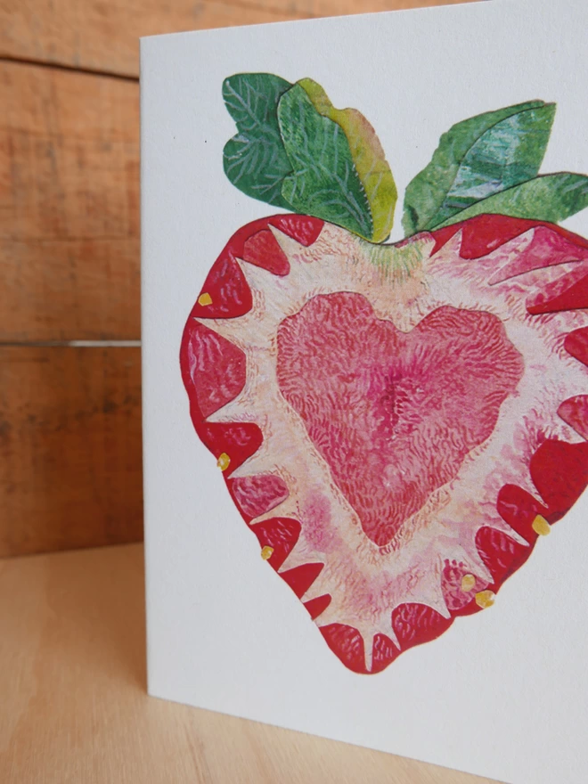 A close up of the illustration on the front of the Strawberry Heart card showing leaves and centre