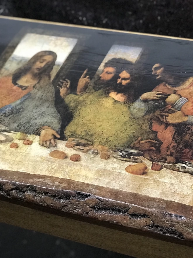 close up the last supper image on wood