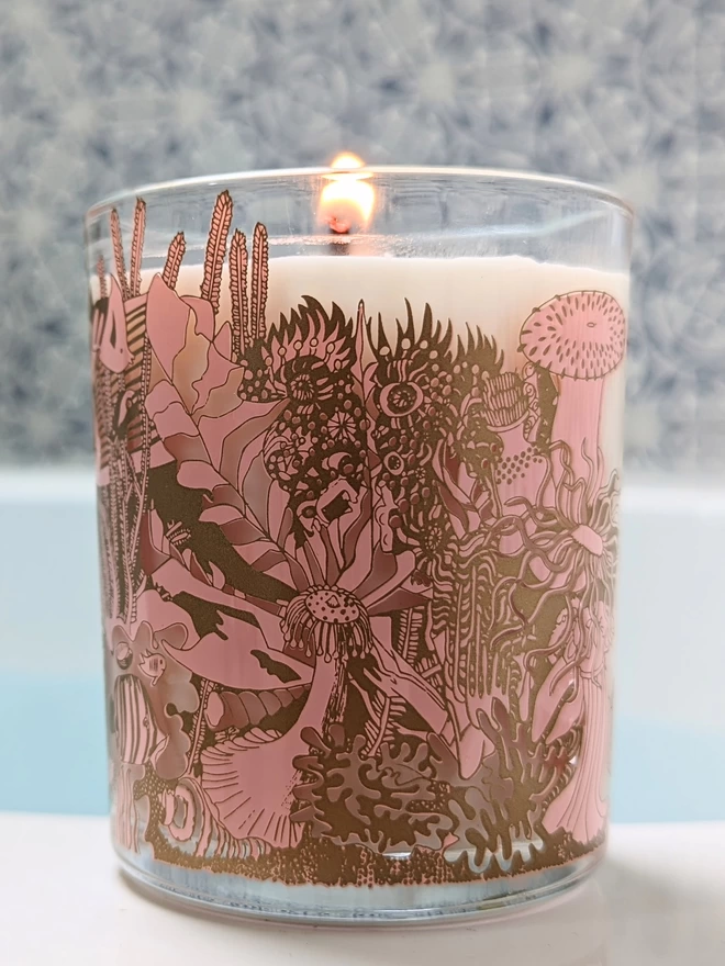 Angels of the deep neroli charity candle in a reusable glass with pink & gold illustrations