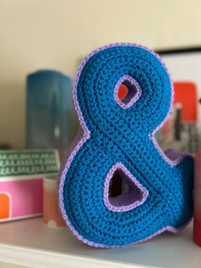 Crochet Cushion shaped like an Ampersand in Blue and Lilac