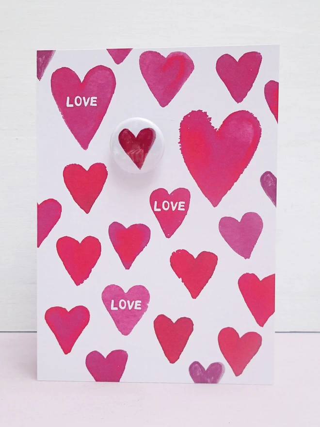 Greeting card with heart pin badge