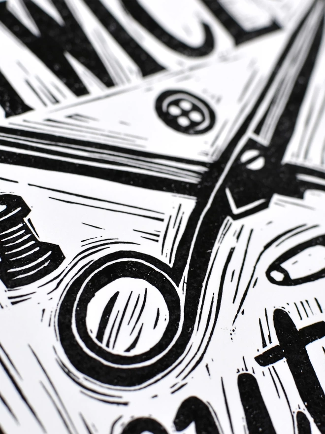detailed view of scissors on black and white sewing print