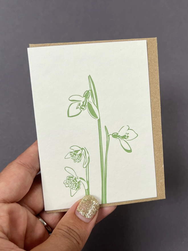 Green letterpress snowdrop design printed on recycled card