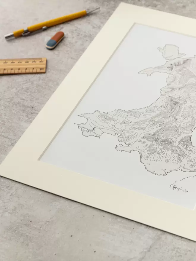 Print of a detailed pen and watercolour drawing of the map of Wales showing contour lines, in a soft white mount