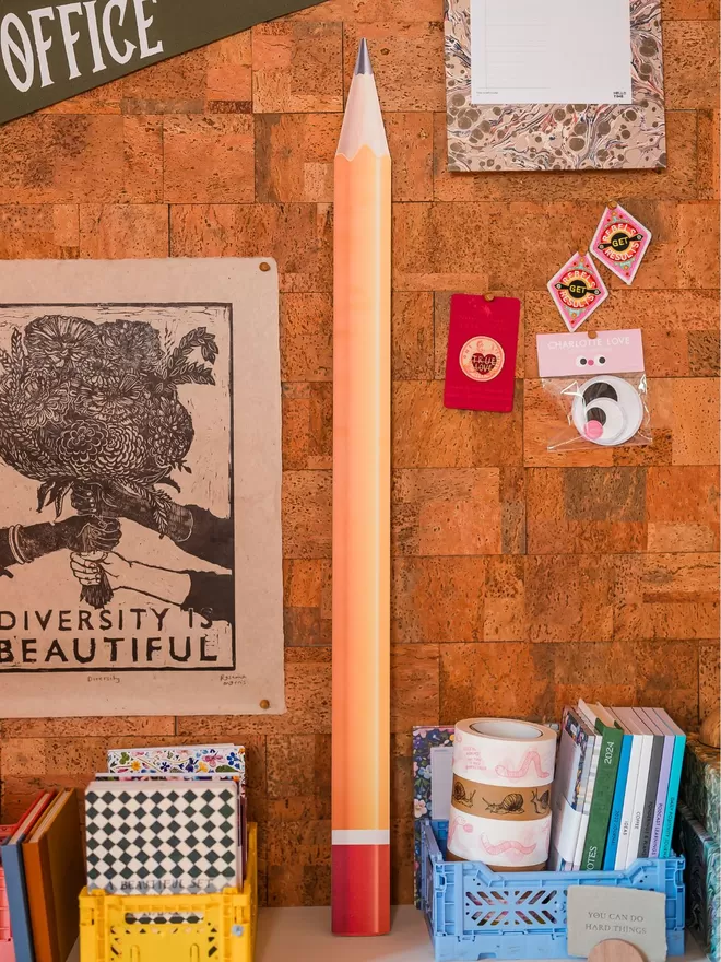 Giant prop pencil seen in a home office