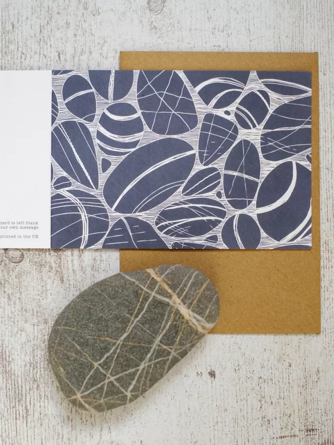 Greeting Card with an image of Pebbles On The Shore, taken from an original lino print