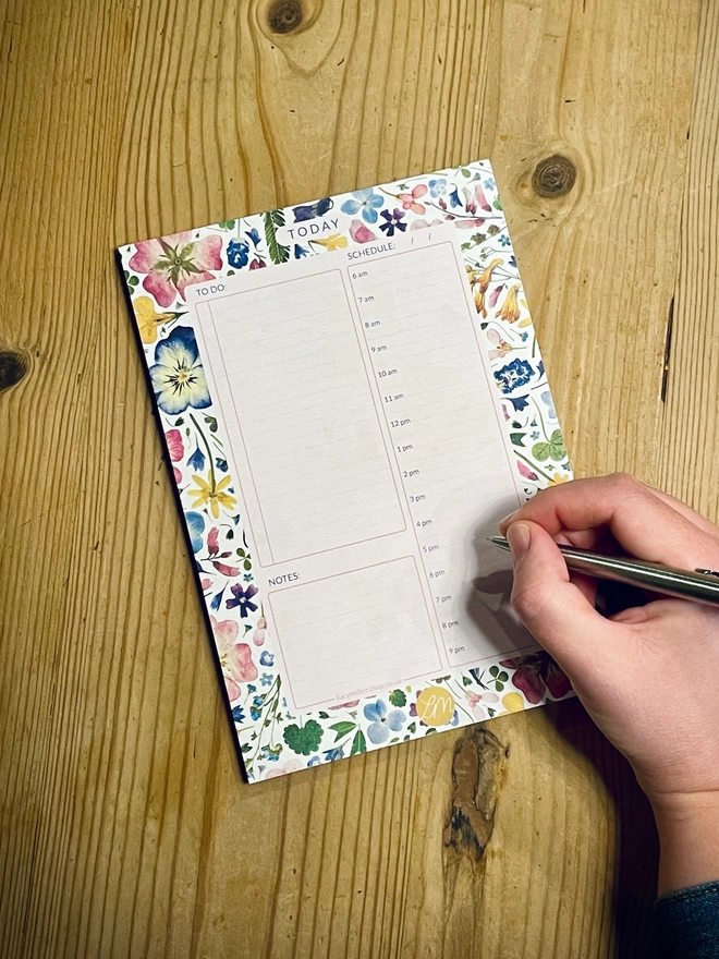 An A5 daily planner pad with pretty pressed flower design. 
