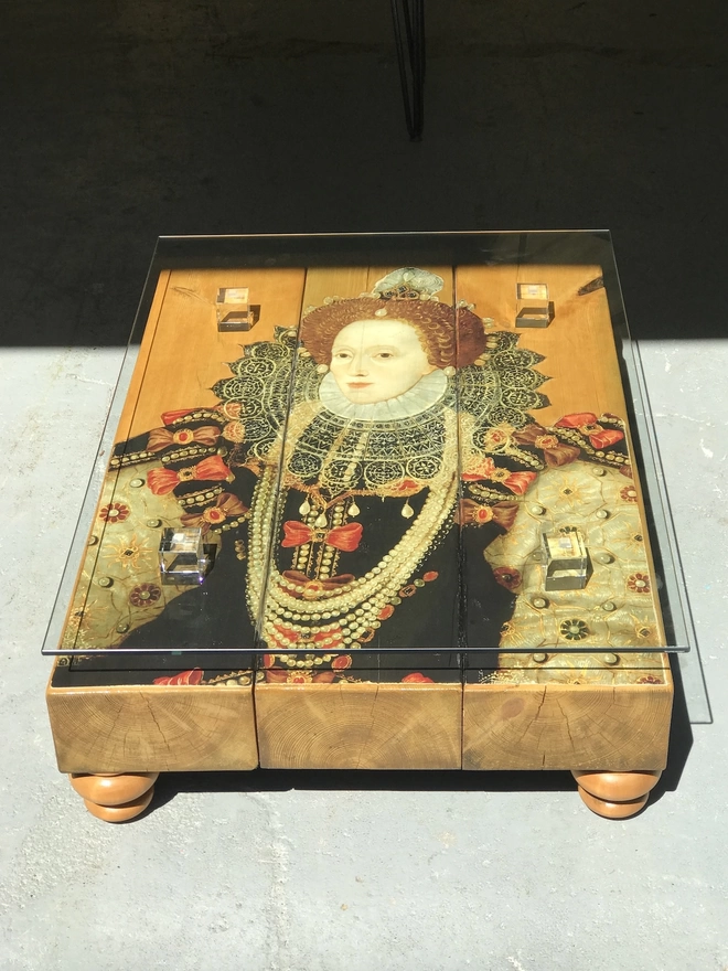 chunky coffee table with image of queen on surface