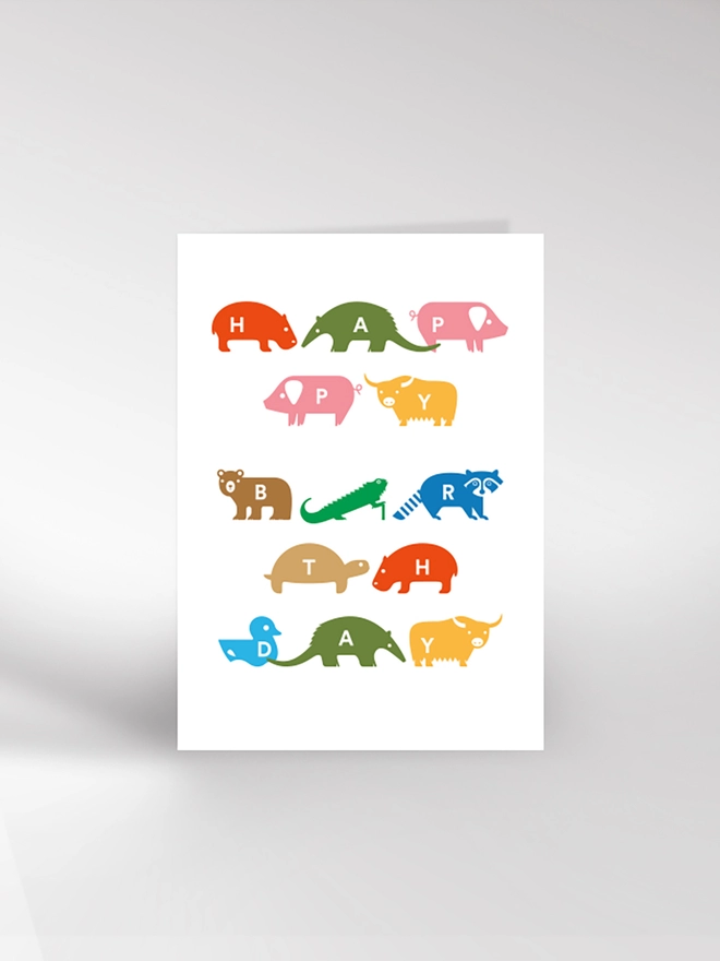 Birthday card with a variety of brightly coloured animals