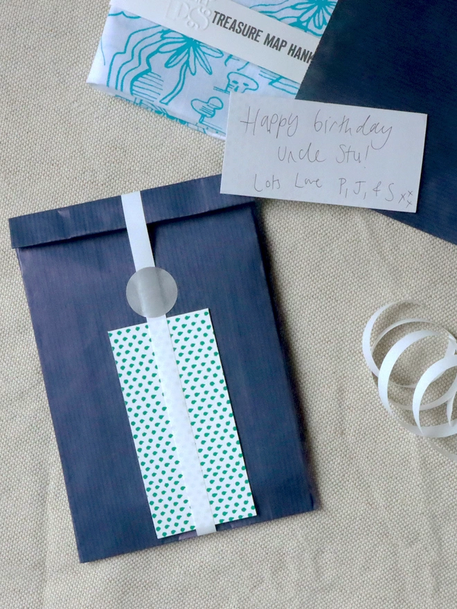 optional gift wrap of navy paper, patterned gift card and ribbon 