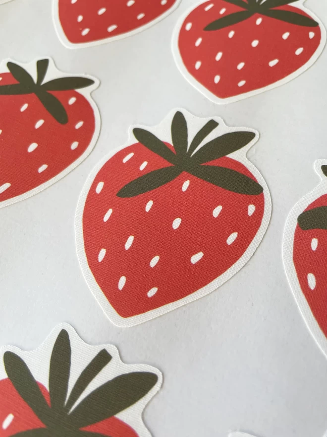Close up of Strawberry fabric wall stickers on sheet