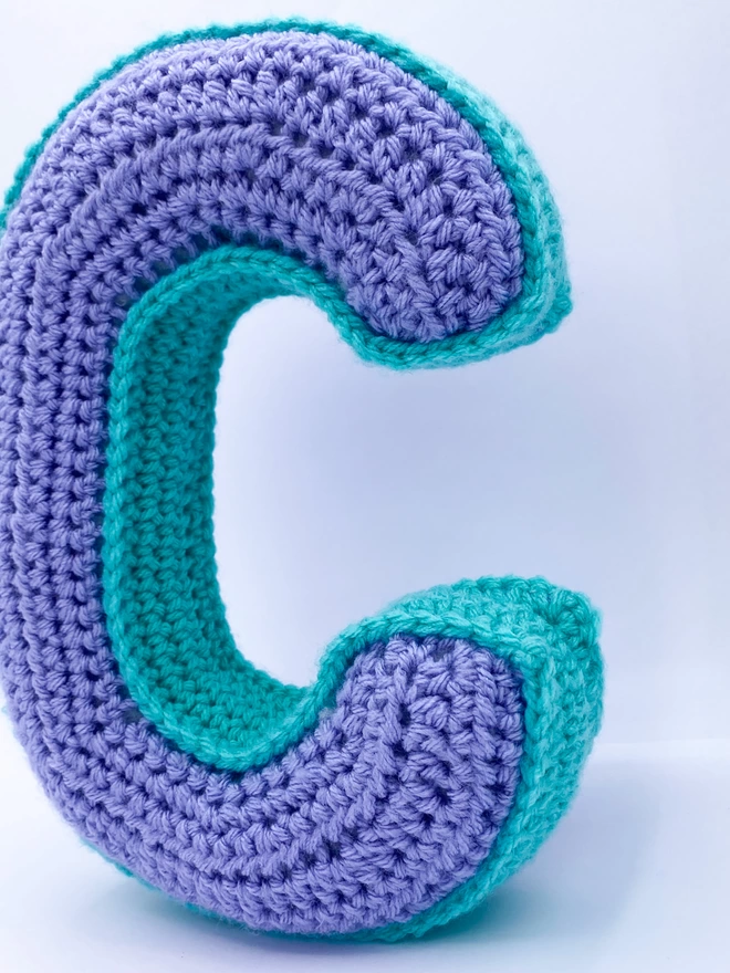 Crocheted C cushion in Lilac and Teal