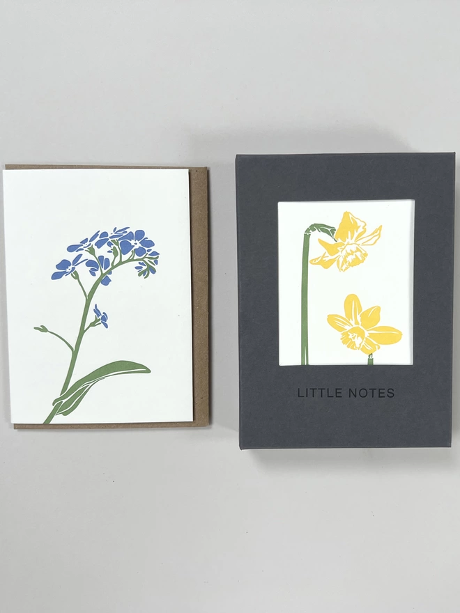 Single forget me not flower with gift box of multiple flora designs