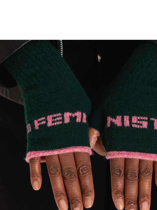 Feminist Fingerless Gloves on a Black Womans Hands 