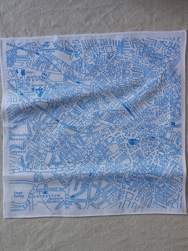 Mr.PS Birmingham vintage map hankie printed in sky blue laid on a linen tablecloth