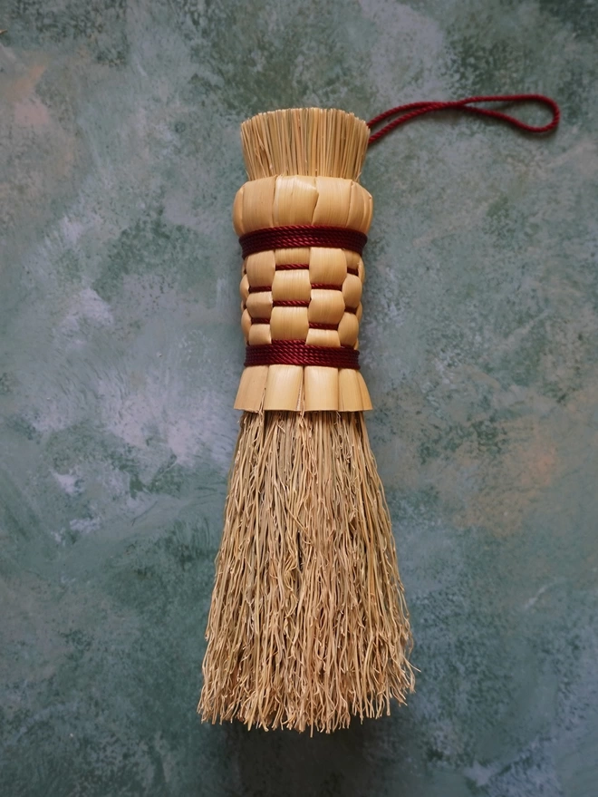 Handmade broomcorn mushroom brush with maroon coloured nylon binding
