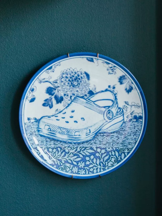 Haus of Lucy Croc Plate seen on a blue wall.