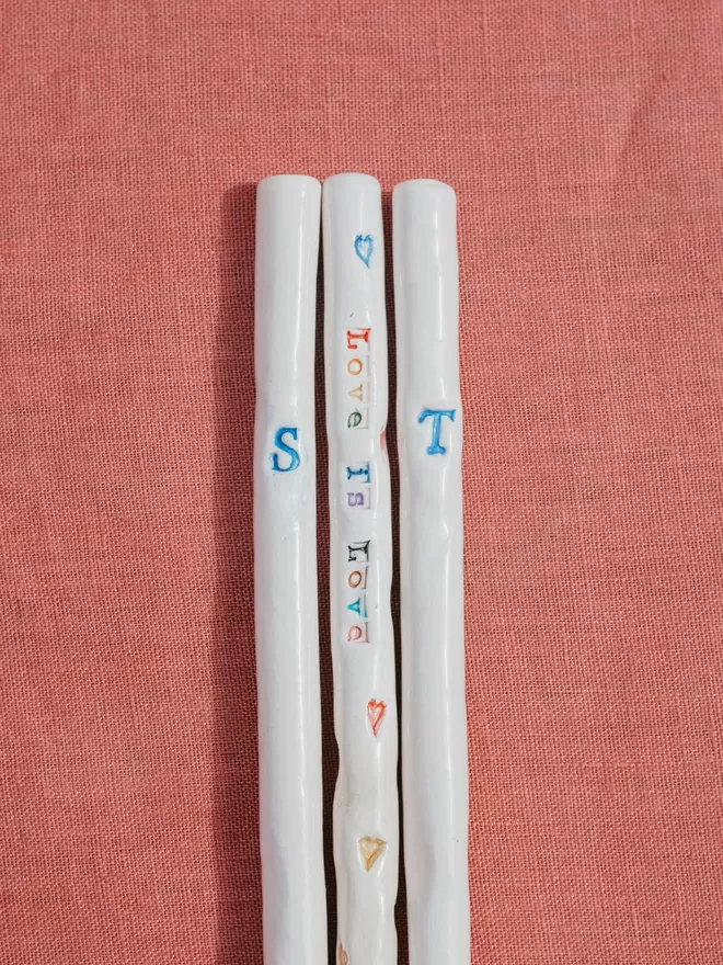 Bill and Ben monogrammed straws seen with the Love is love rainbow straw.
