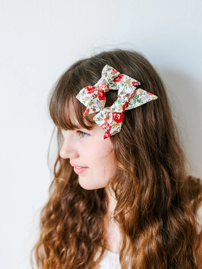 Gril with red floral liberty hair bows 
