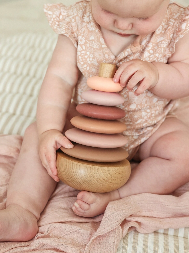 Silicone ring baby stacking toy on wooden base