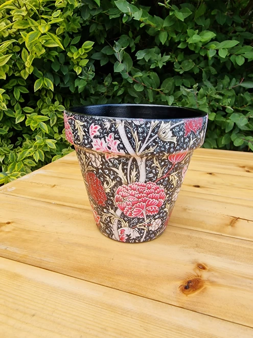 William Morris Cray design plant pot in a black and pink detailed floral design suitable for indoor or outdoor use.  15 cm in diameter and 13.7 cm in height