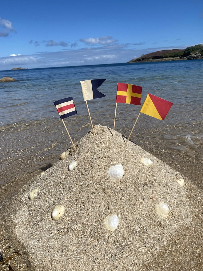 Sandcastle flag kit showing the letters C A R and O