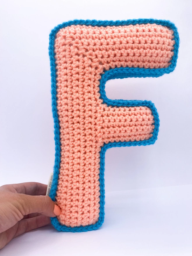Crocheted F Cushion in Peachy Pink & Light Blue