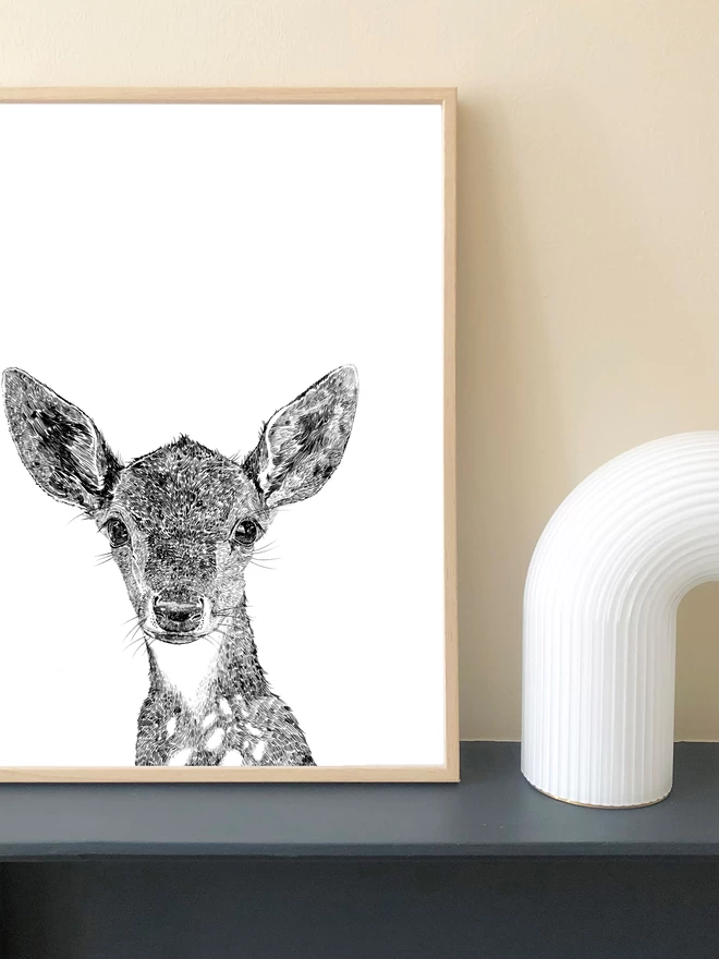 Art print of a hand drawn deer displayed in a frame