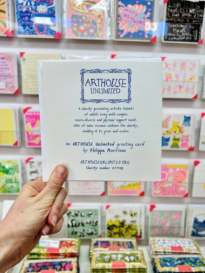 Back of Smile Inside Shine Outside riso printed card featuring the Arthouse Unlimited logo