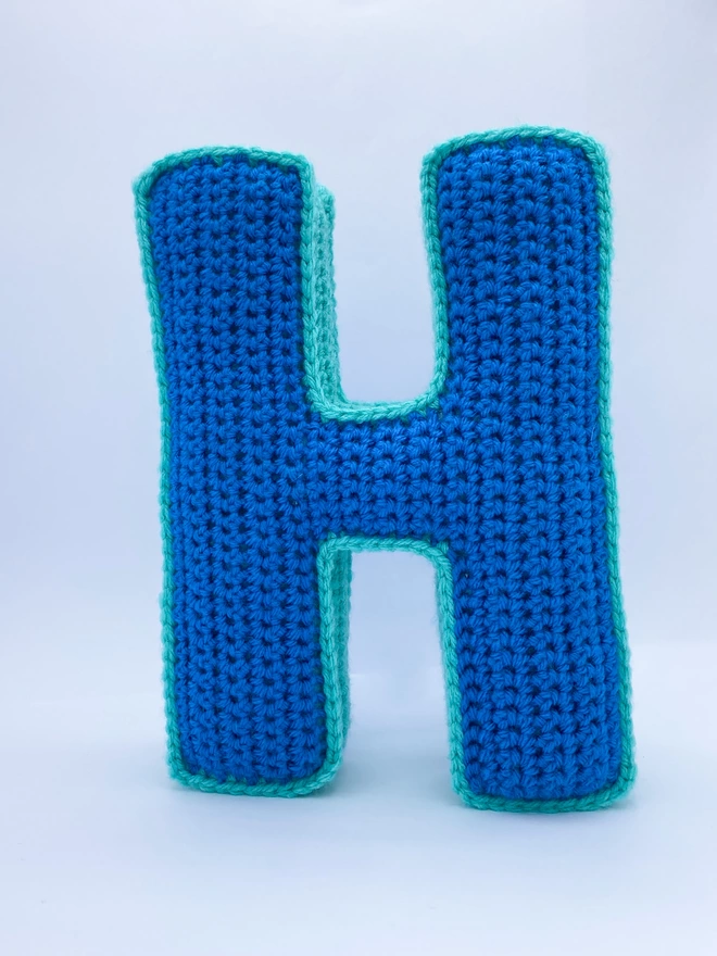 Crochet Cushion shaped like an H in Light Blue & Teal