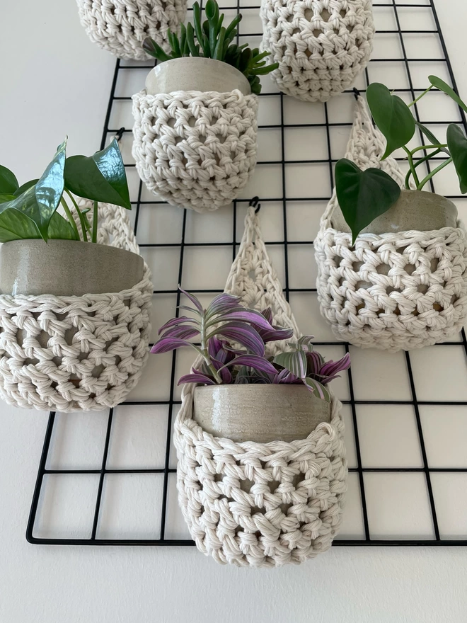 indoor small white cotton hanging wall planter, white fabric wall mounted plant holder, handmade crochet plant basket, handmade sustainable crochet decor, rustic natural organic homeware accessories, hanging plant pot holder