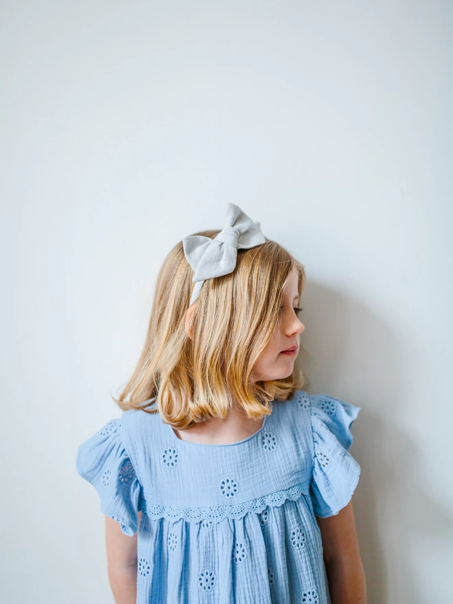 Girl with pale blue alice band