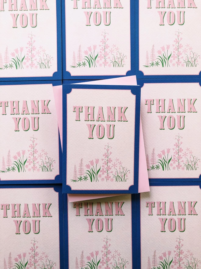 'Thank You' Floral Charity Greeting Card illustrated with pink and green flowers blue border hand lettering