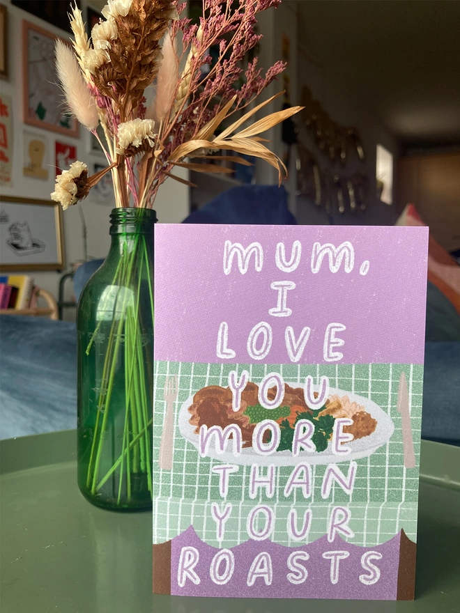 Greetings card illustrated with image of a roast dinner, with the message of 'Mum, I love you more than your roasts'