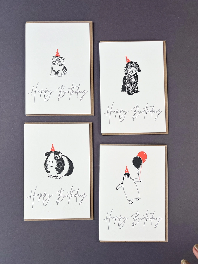 A mix of four animals wearing neon party hats, Birthday cards