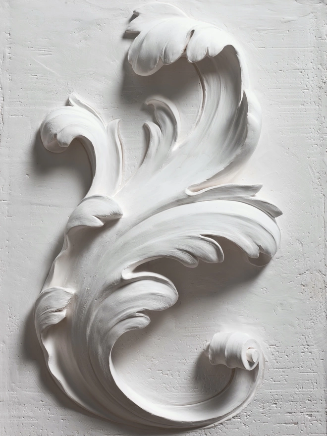 Detail of plaster of Paris bas-relief wall sculpture with raffle leaf design 