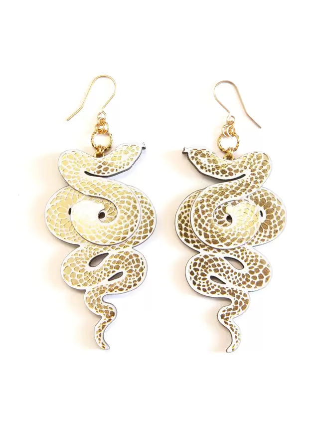 large gold & white serpent earrings