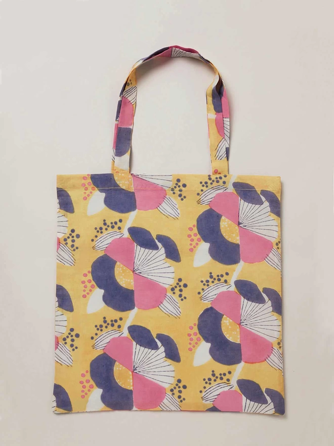 Yellow block printed tote bag in large scale pink, navy and cream floral print 