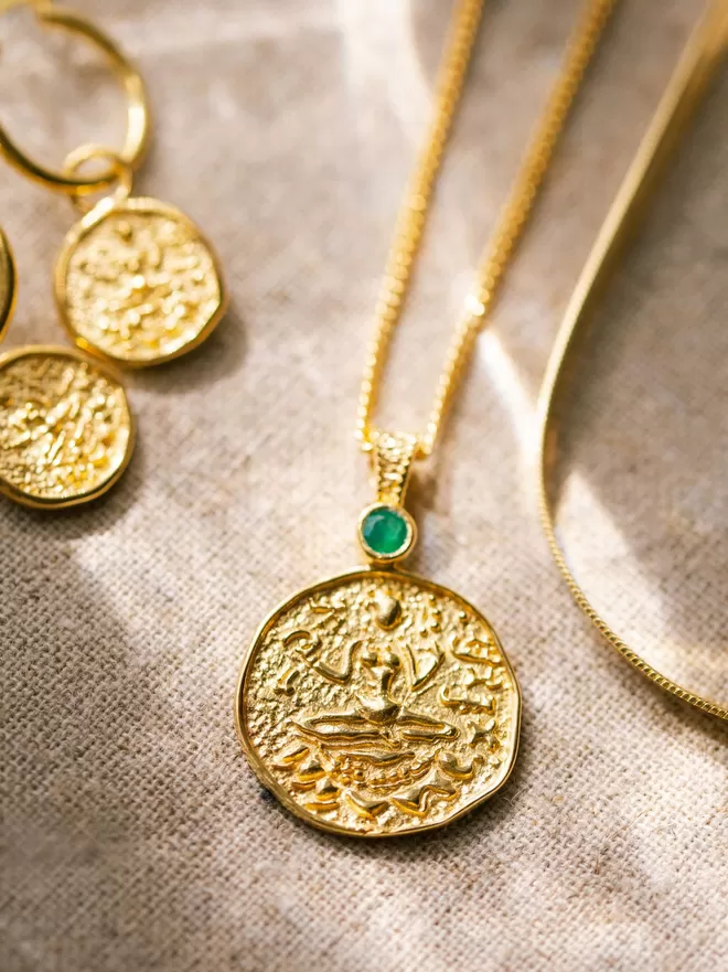 Lakshmi gold coin pendant with green onyx