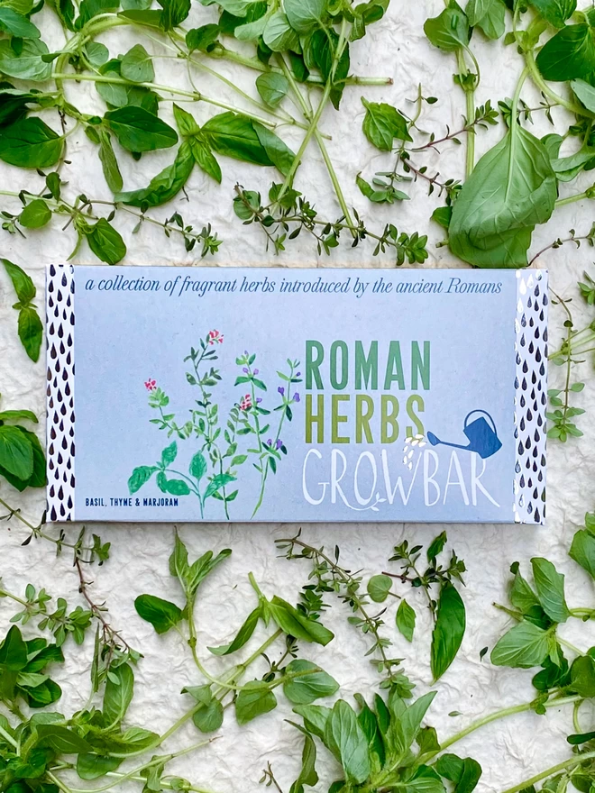 The Roman Herbs Growbar on a bed of fragrant basil, thyme and marjoram herbs.