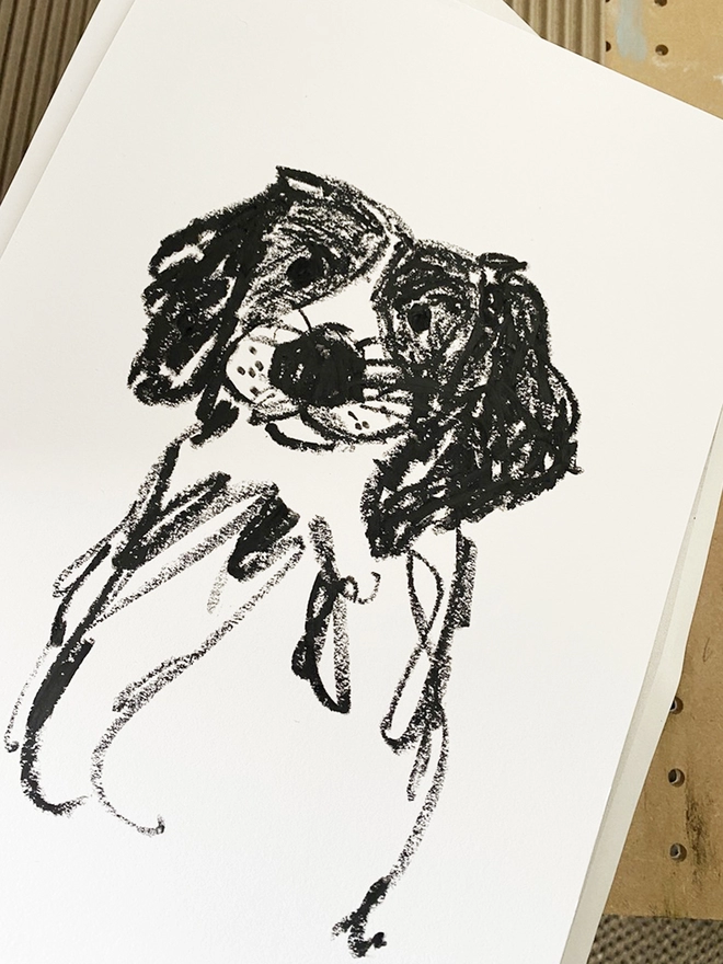 black and white line drawing of dog on white paper