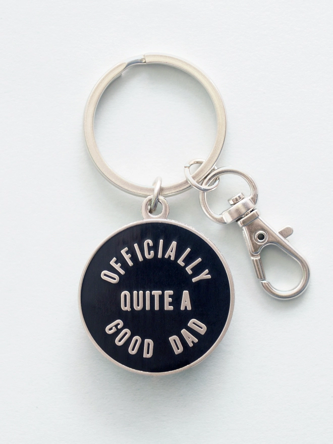 Black and silver enamel keyring with 'Officially Quite a Good Dad' design