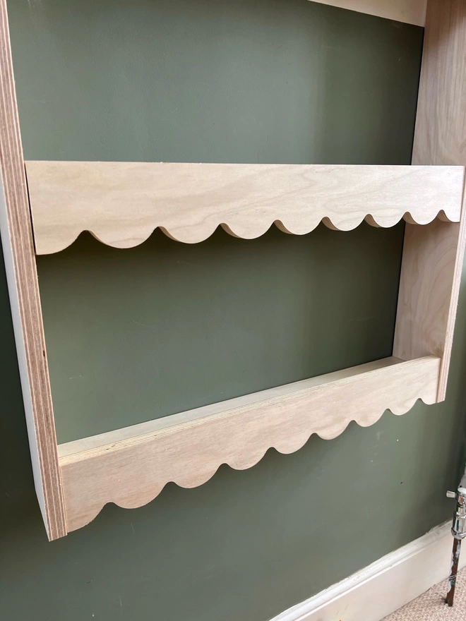Scalloped plywood wall shelf
