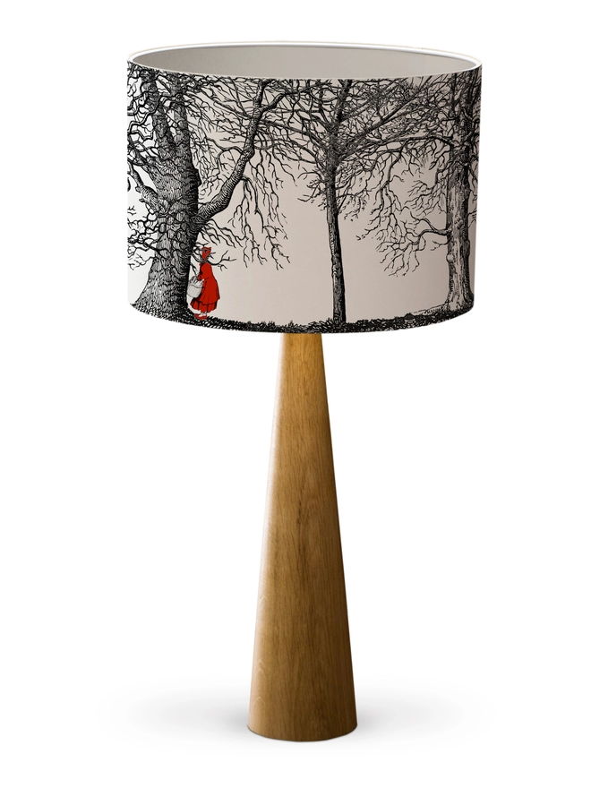 Drum Lampshade featuring Red Riding Hood with a white inner on a wooden 