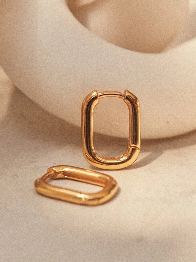 pair of small elongated gold hoop earrings
